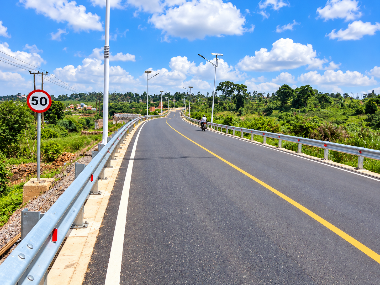 Mukono Municipality Roads LOT 3 – asphalt road with guardrails and street lighting